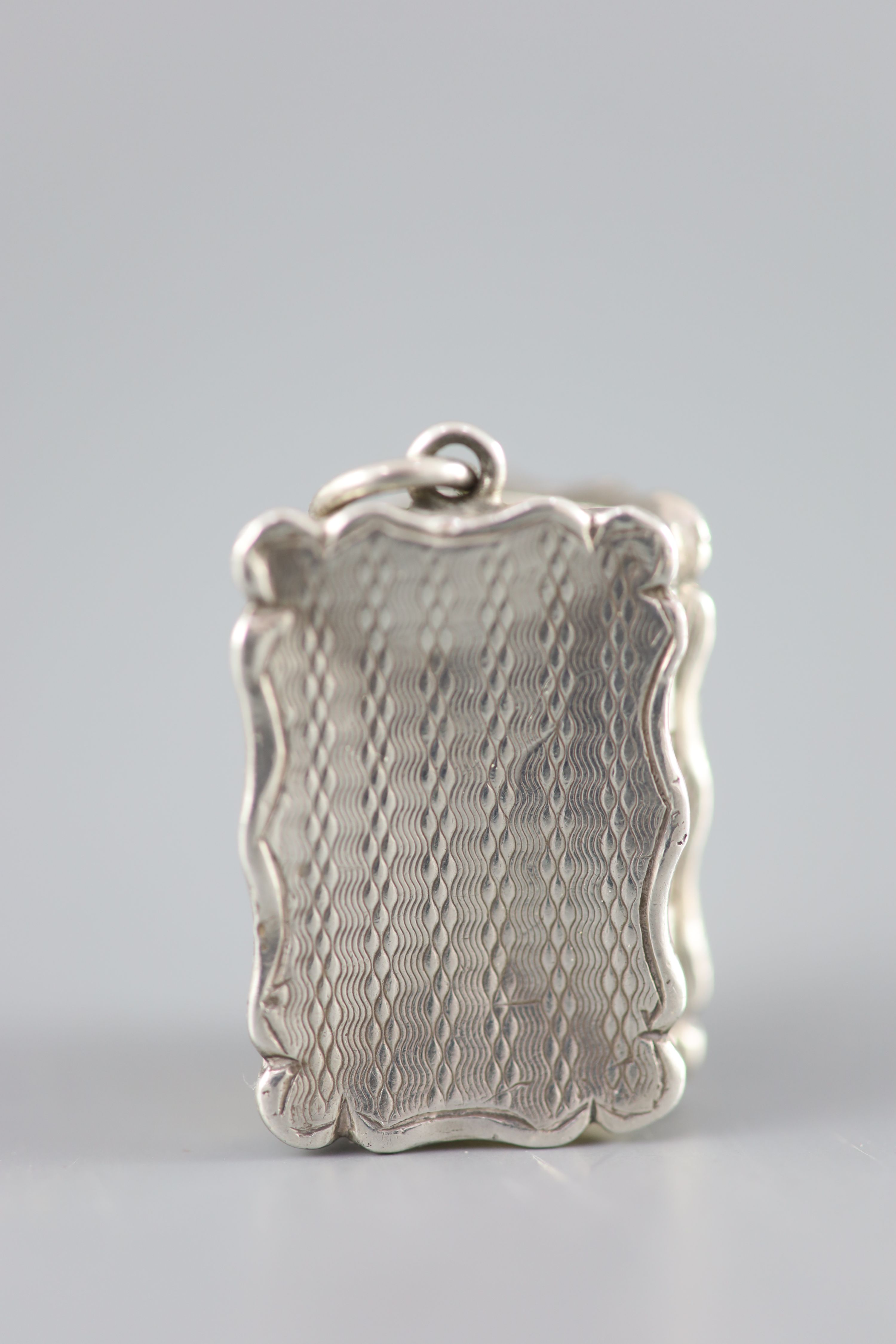 A Victorian silver rectangular vinaigrette, with engine turned ornament and ring, Frederick Marsden, Birmingham, 1860,